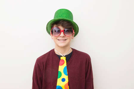 young man in clothes and carnival costume on white backgroundの写真素材