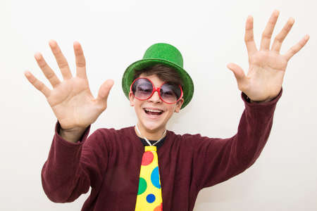 young man in clothes and carnival costume on white backgroundの写真素材