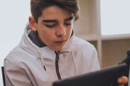 teenager with a digital tablet or laptop