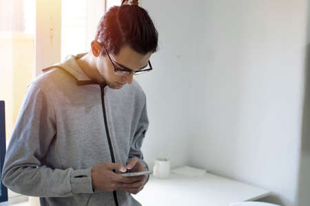 young to fashion with mobile phoneの写真素材