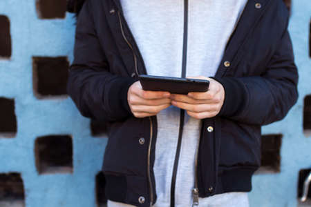 closeup of hands with digital tablet or ebookの写真素材