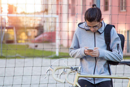 young bike with outdoor mobile phoneの写真素材