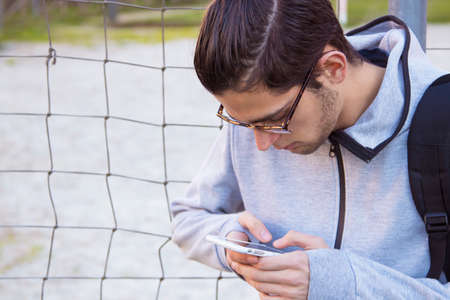 young with outdoor mobile phone