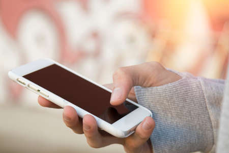 hand phone in the city
