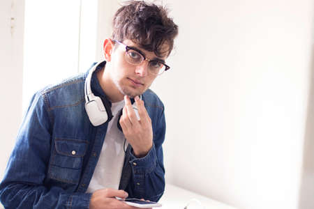 young with headphones and mobile phone