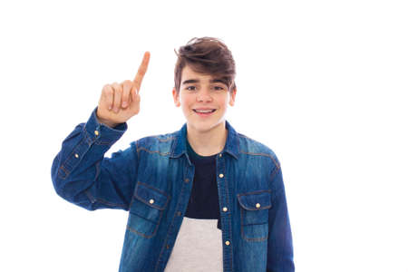 young teenager isolated in white with raised finger pointing