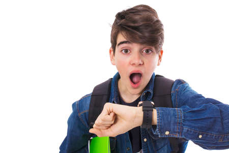 looking at the watch with frightened expression, being lateの写真素材