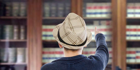 Child or young person in the library with books
