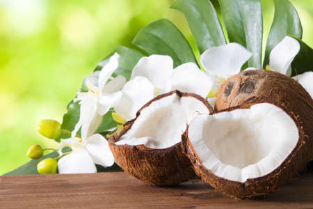 Coconut open to natural on wooden bottomの写真素材