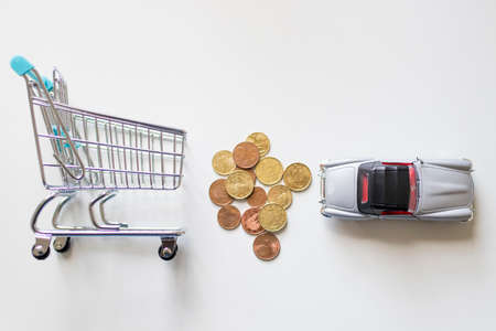 Shopping cart with money and car, buy car