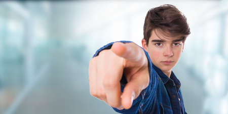 teenage portrait pointing with finger