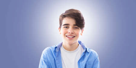 portrait of teenager on the blue backgroundの写真素材