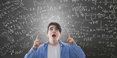 student amazed with graphics background and formulasの写真素材