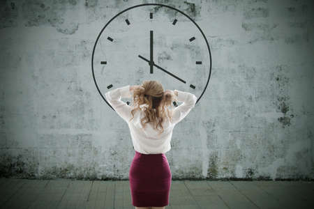 business woman with clock, timetable and punctualityの写真素材