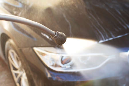 hands with hose washing car, cleaning carsの写真素材