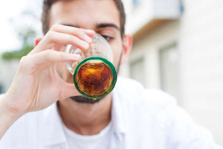 close-up of young man drinking