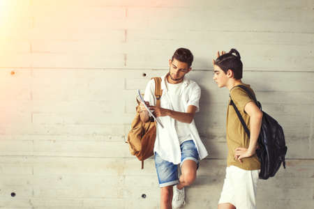 young students with books on campus or collegeの写真素材