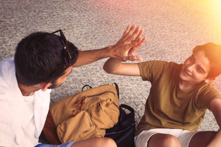 young teenage students celebrating success, positive concept