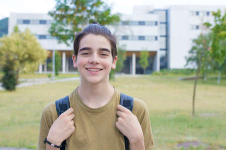 student with backpack at college or university