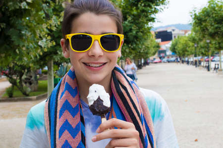 eating ice cream outdoors on the street in summer