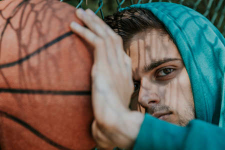 young athlete with basketballの写真素材