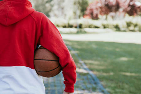 young with the basketball in the open air handの写真素材