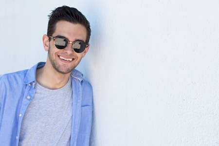 fashionable young man on the street wall