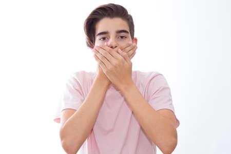 young teenager with a sign of silence or quietの写真素材