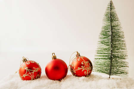 christmas tree and decorative balls with snow, christmas backgroundの写真素材
