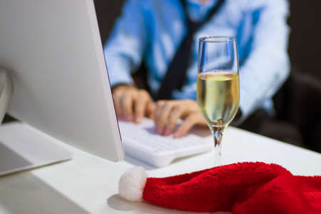 glass of champagne in the office on christmas dayの写真素材