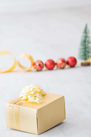 christmas gift box with ornaments backgroundの写真素材