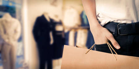 hand with shopping bagsの写真素材