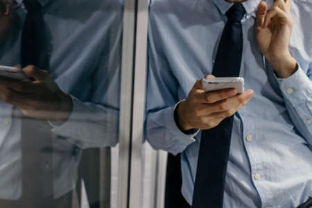 closeup phone and business man