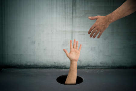 hand in the hole asking for help, collaboration