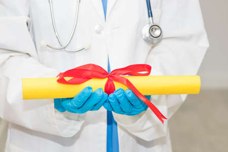 doctor with diploma and graduation in medicineの写真素材
