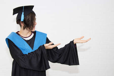 young isolated in a graduation suitの写真素材