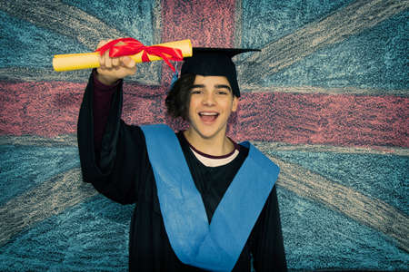 student with graduation uniform and background flag