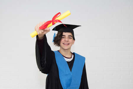 young isolated in a graduation suit
