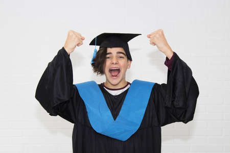 young isolated in a graduation suitの写真素材