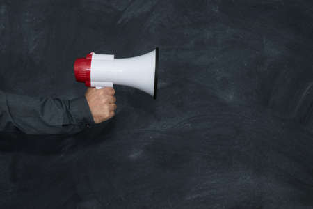 hand with megaphone and schoolの写真素材