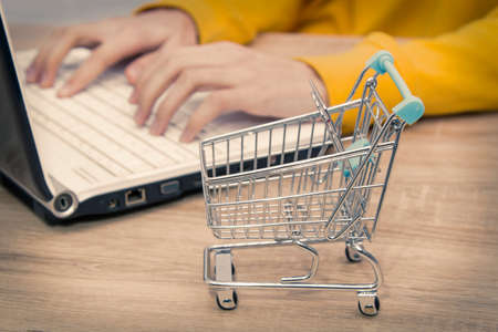 buy cart with computer, shopping onlineの写真素材