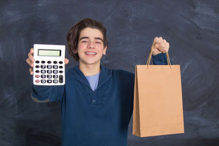 young with calculator and bag, shopping and economy