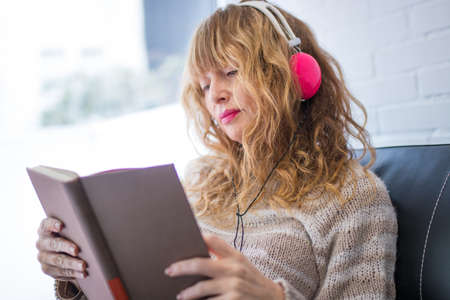adult woman listening to music with headphones
