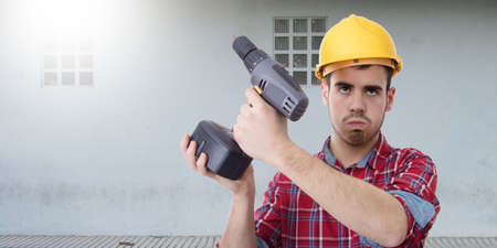 constructor with drill, renovations, repairs and bricolageの写真素材