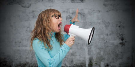 adult woman with megaphoneの写真素材