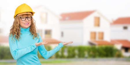 woman building, architect or real estate with houses and buildingsの写真素材