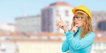woman building, architect or real estate with houses and buildingsの写真素材