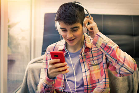 young with headphones and mobile phone