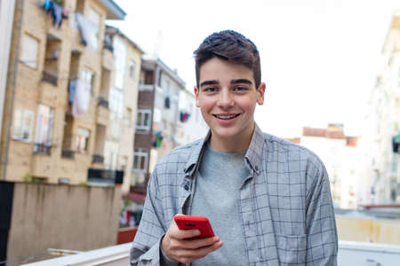 young with outdoor mobile phone in the city