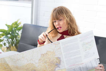woman with map preparing the trip